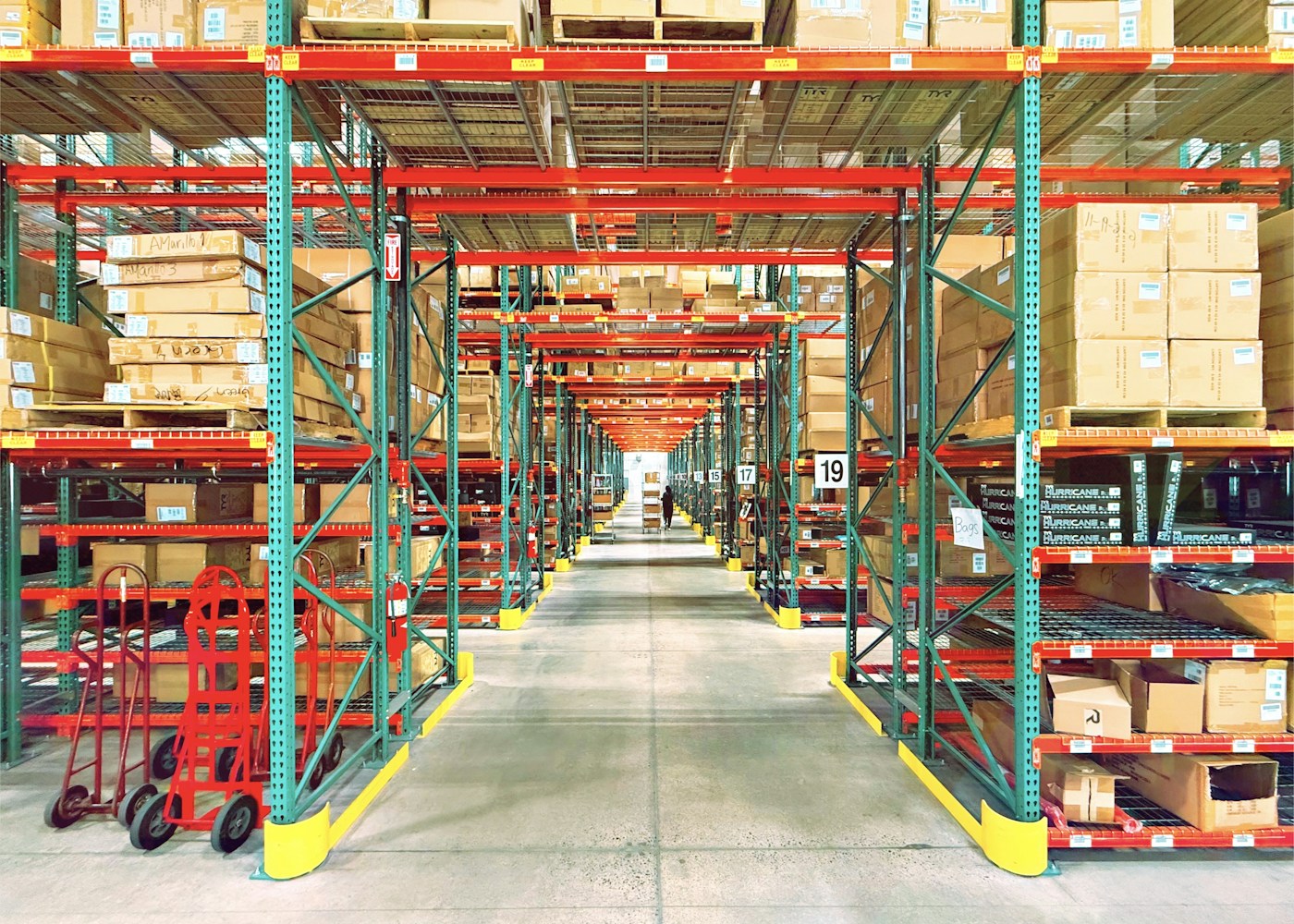 Warehouse racks and aisle, illustrative industry photography